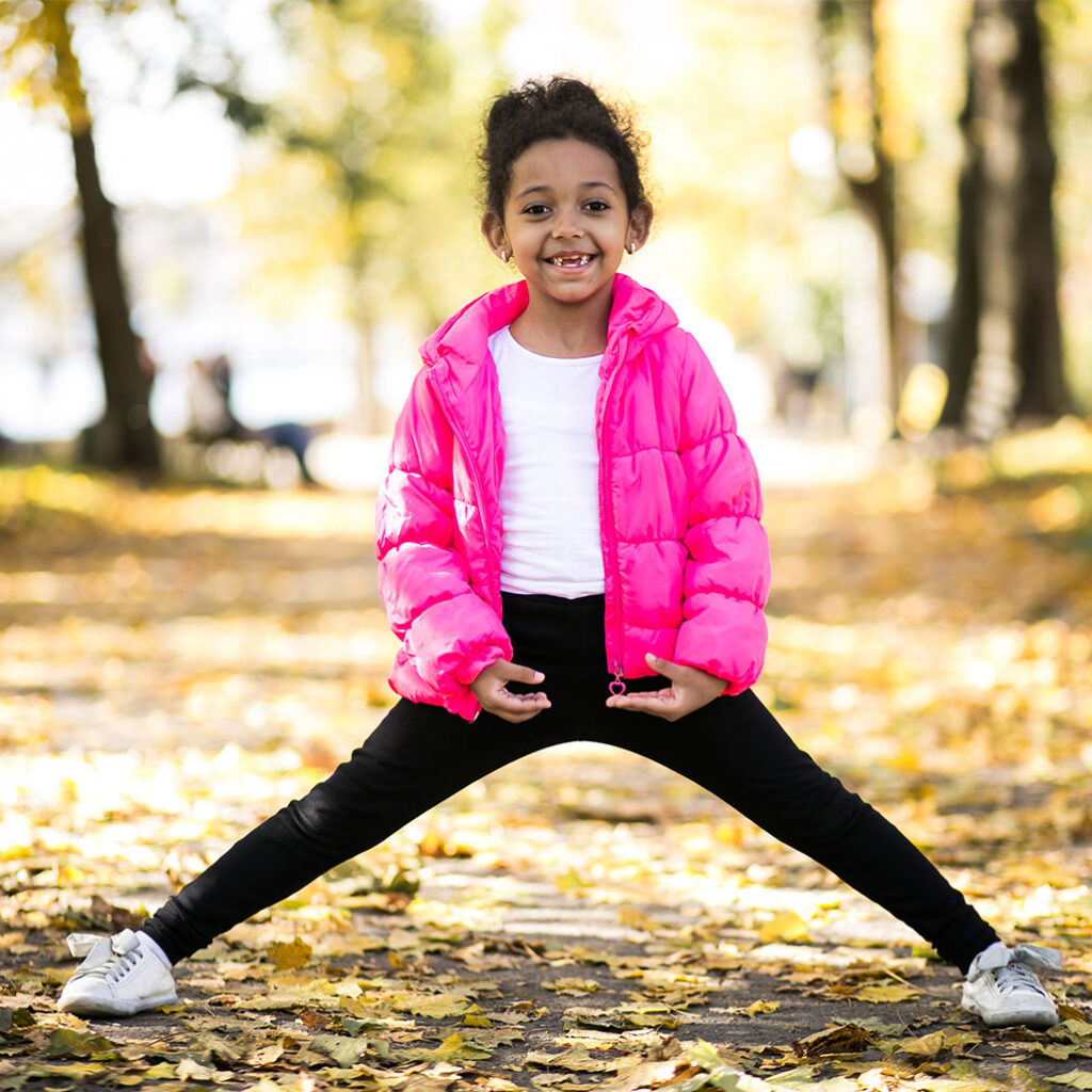 small girl doing stretches