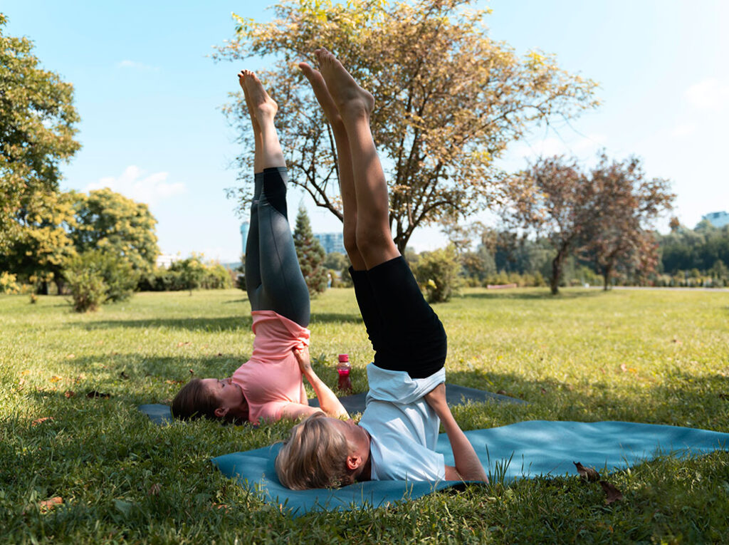 two teens practicing yoga